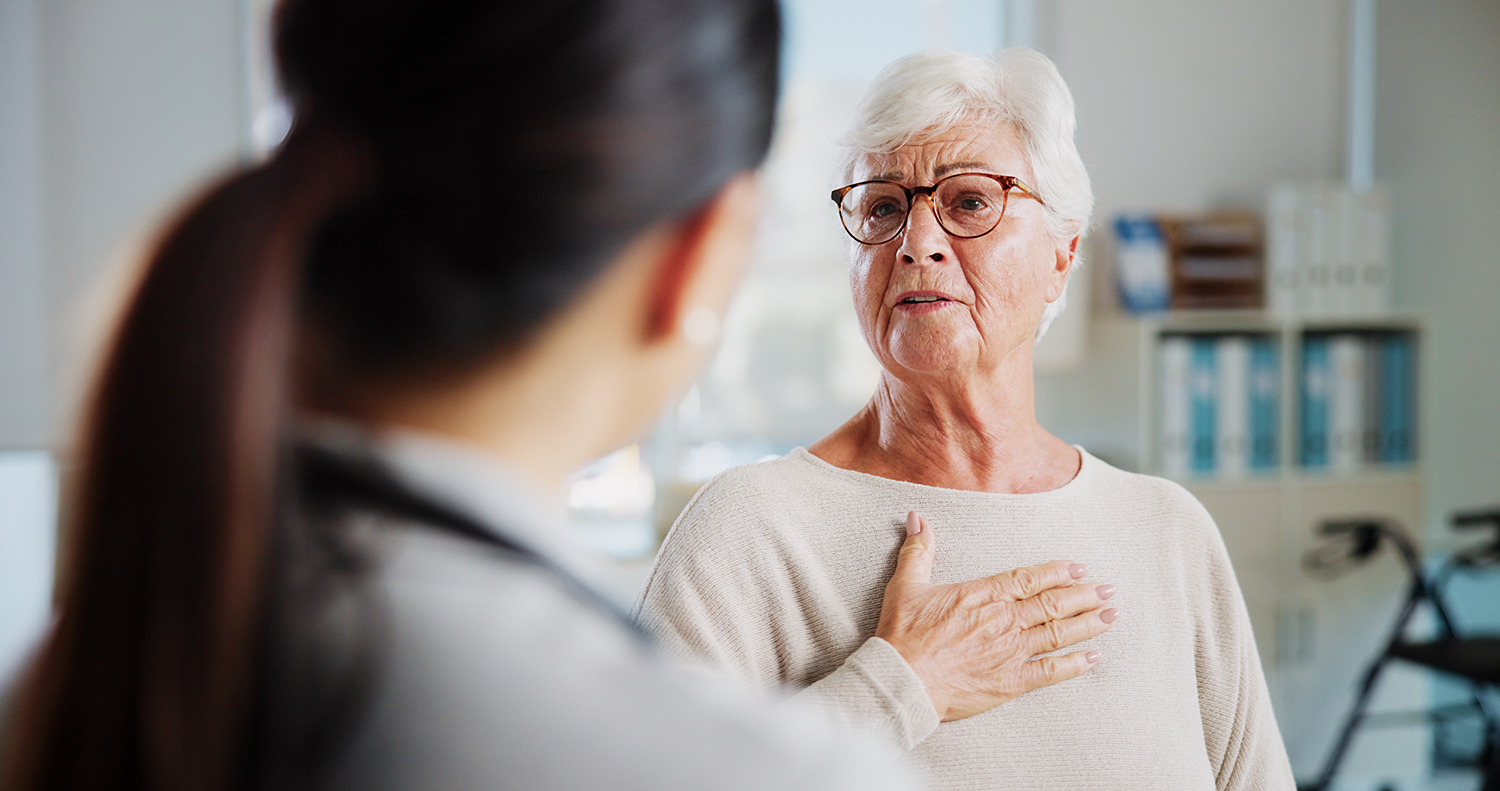 Concerned Elderly patient speaking with doctor