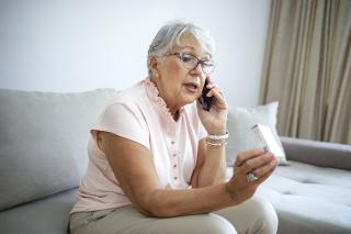 Senior speaking to CareLine team member after hours